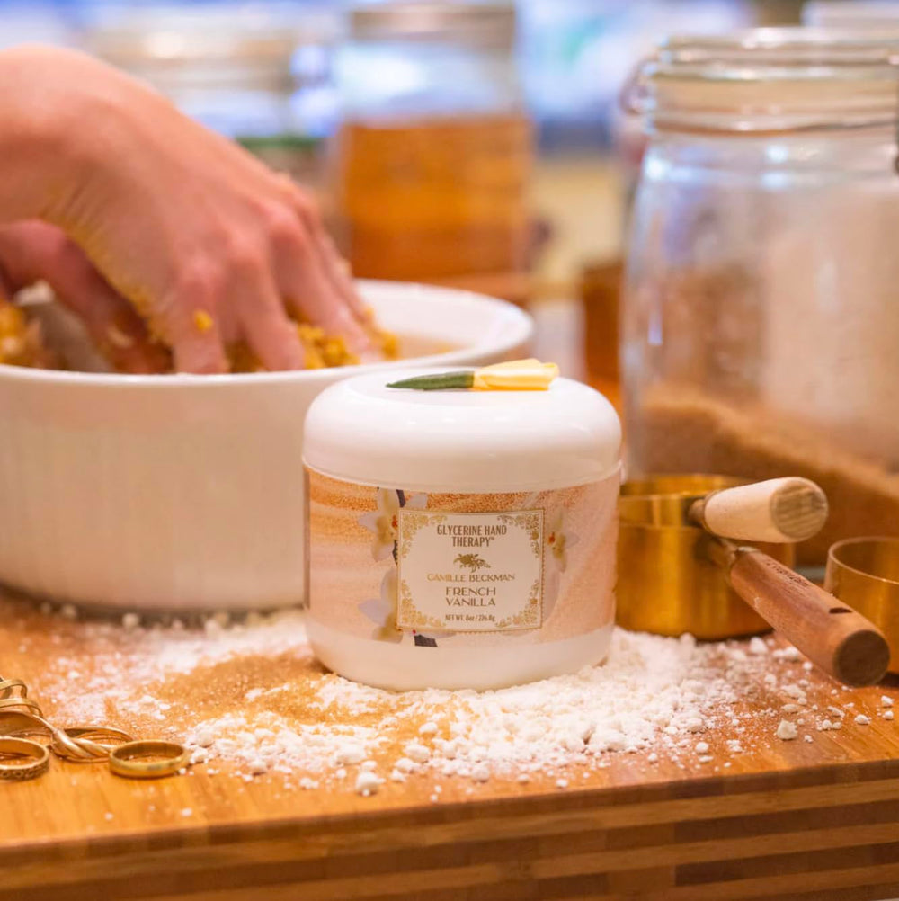 Camille Beckman ingredients label highlights aloe, vitamin E, and almond oil for nourished skin.