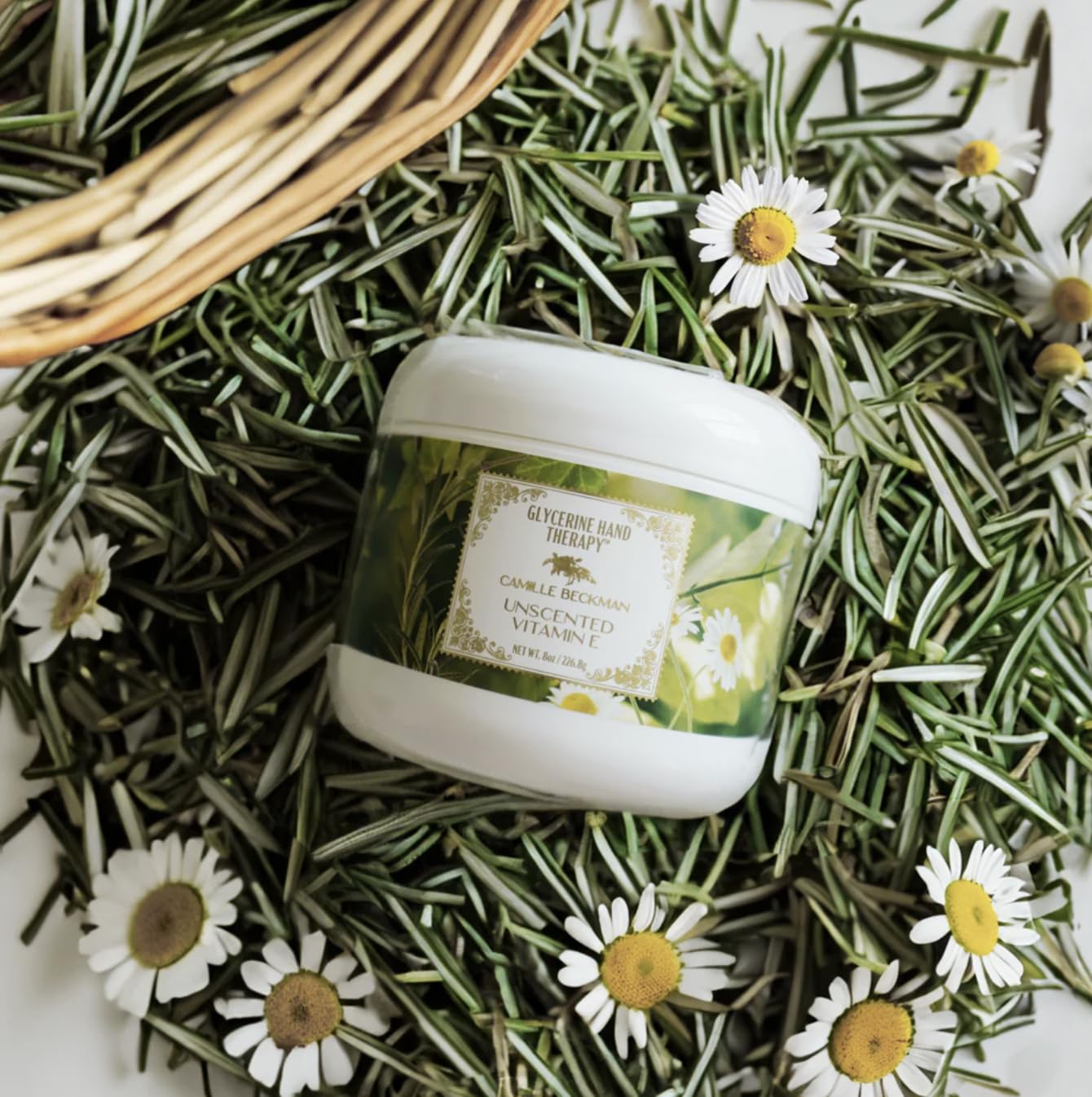 Camille Beckman hand cream being applied for soothing daily relief.