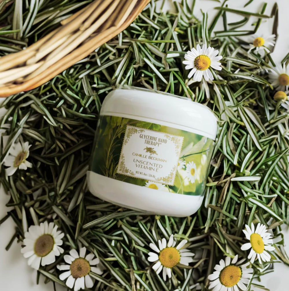 Camille Beckman hand cream being applied for soothing daily relief.