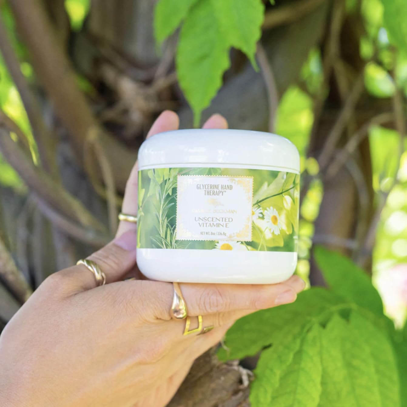 Camille Beckman close-up shows skin-softening cream texture.
