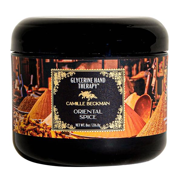Camille Beckman Oriental Spice hand-therapy bottle highlighting rich glycerin moisture for daily use