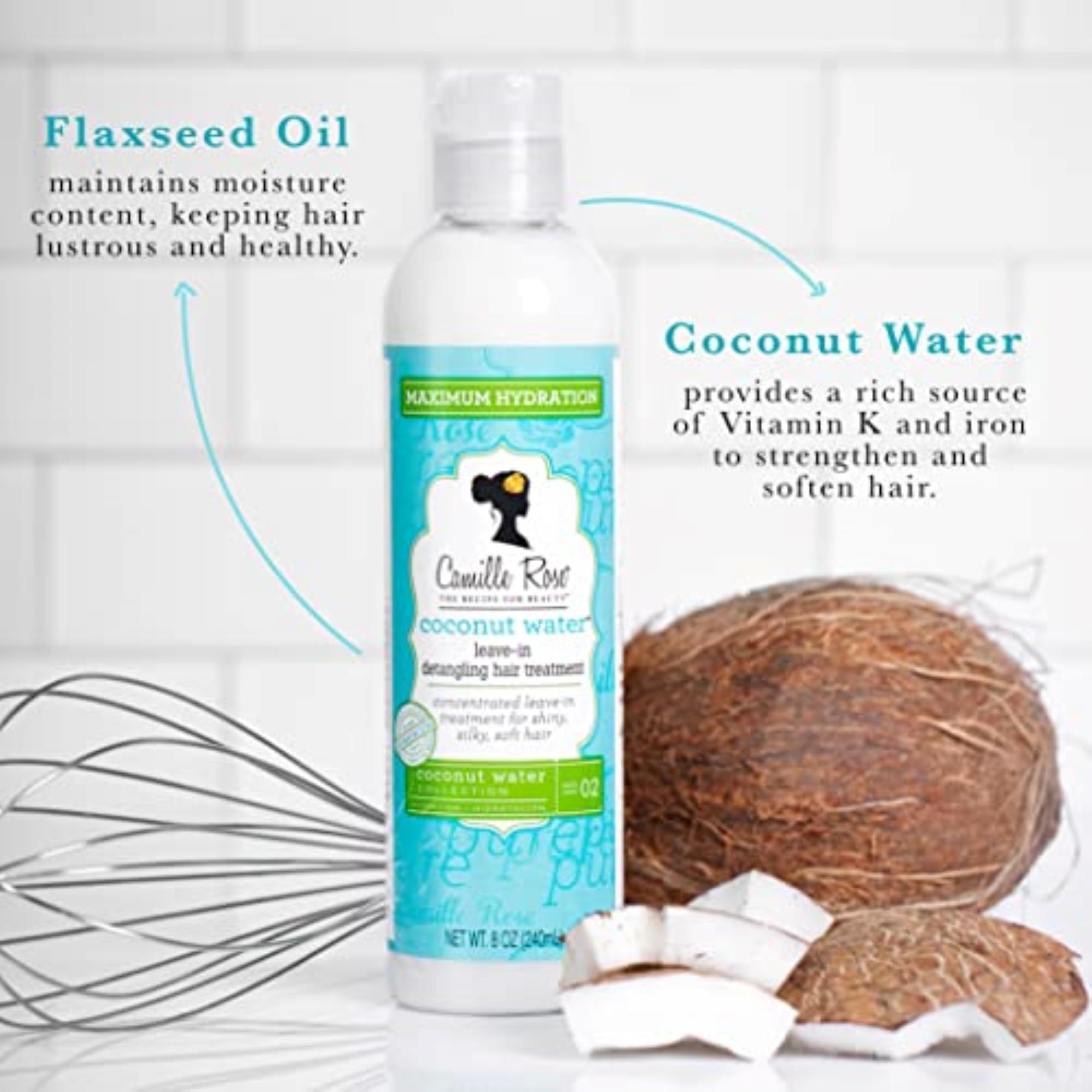 Camille Rose Coconut Water Leave-In applied to wet hair for smooth detangling and frizz control.