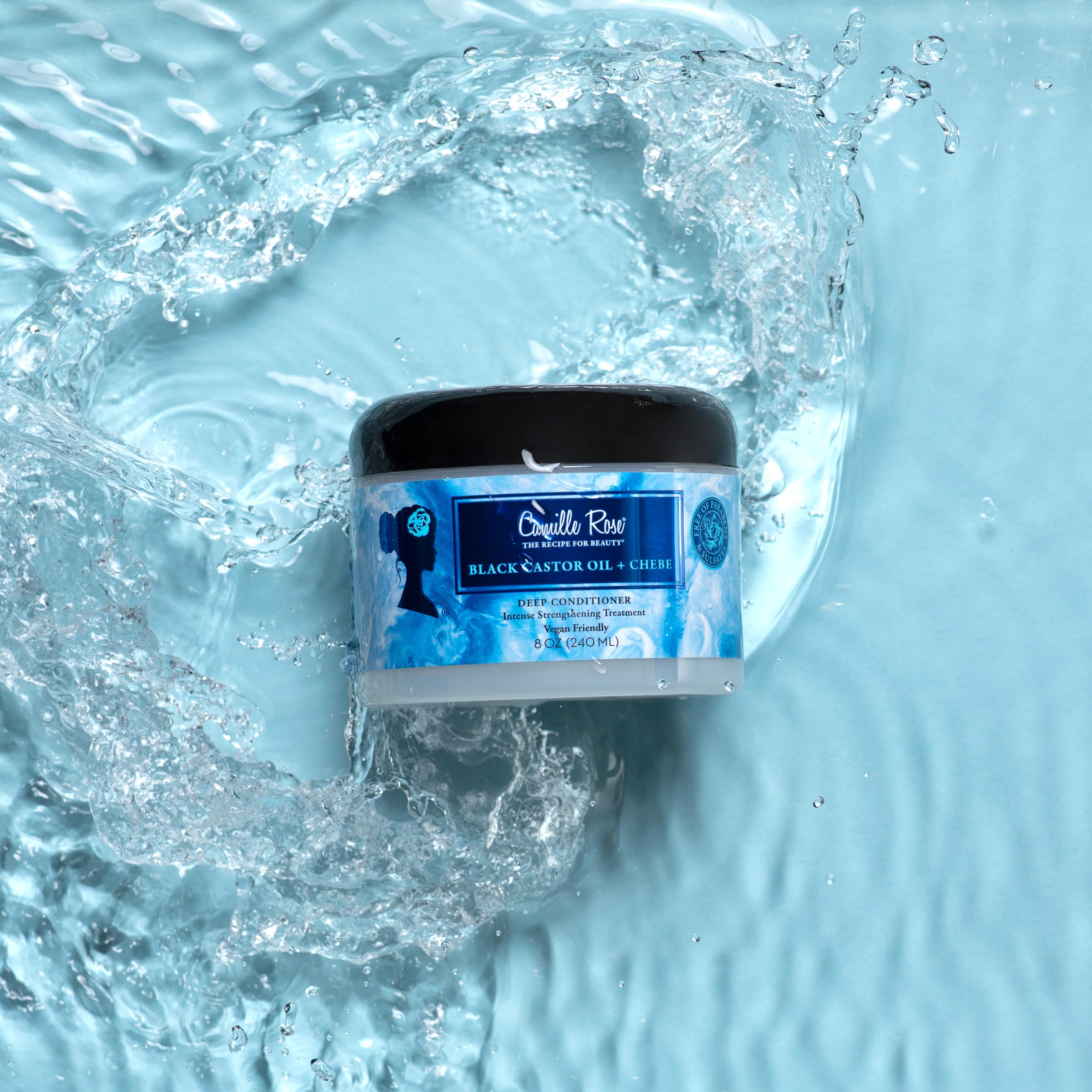Camille Rose Deep Conditioner applied along hair lengths for even moisture distribution.