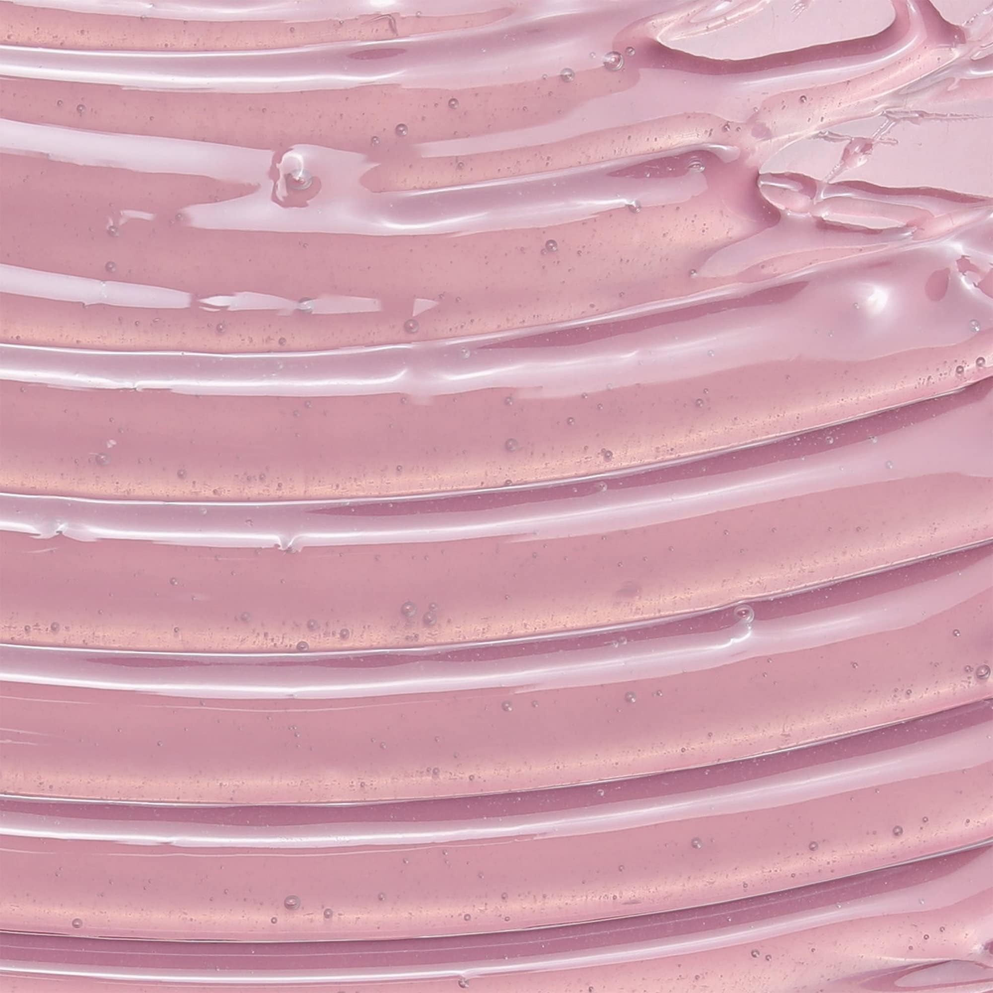 Camille Rose leave-in conditioner label close-up emphasizes rosemary and castor oil blend.