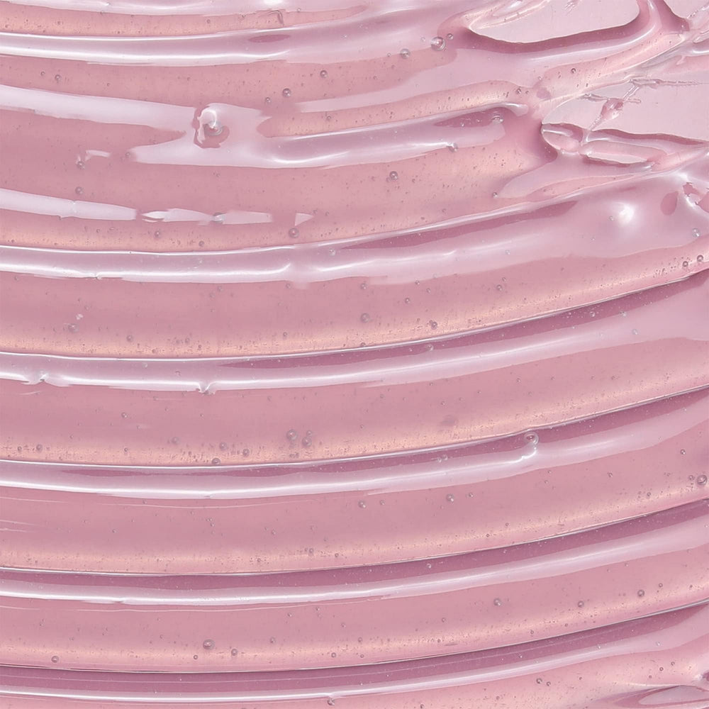 Camille Rose leave-in conditioner label close-up emphasizes rosemary and castor oil blend.