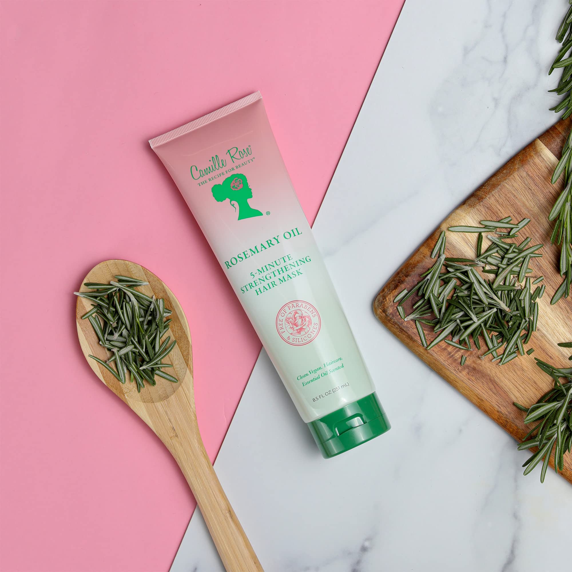 Camille Rose Rosemary Oil ingredients closeup showcases rosemary and biotin blend