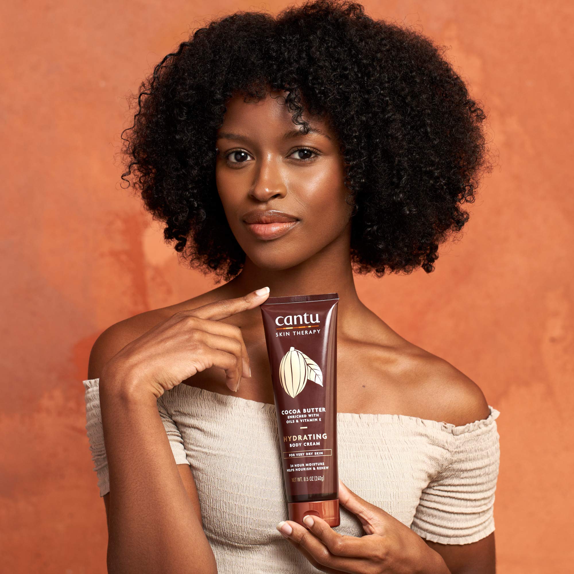 Cantu Therapy Cocoa Butter Body Cream texture suggests a rich, luxurious formula