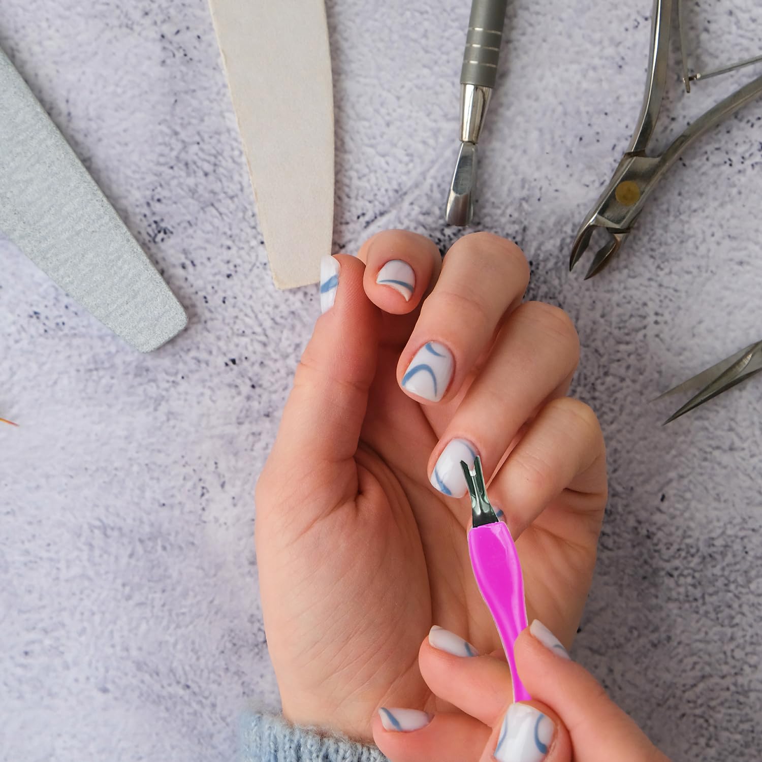 Caiqicome dual-ended tool suitable for salons and home manicures.
