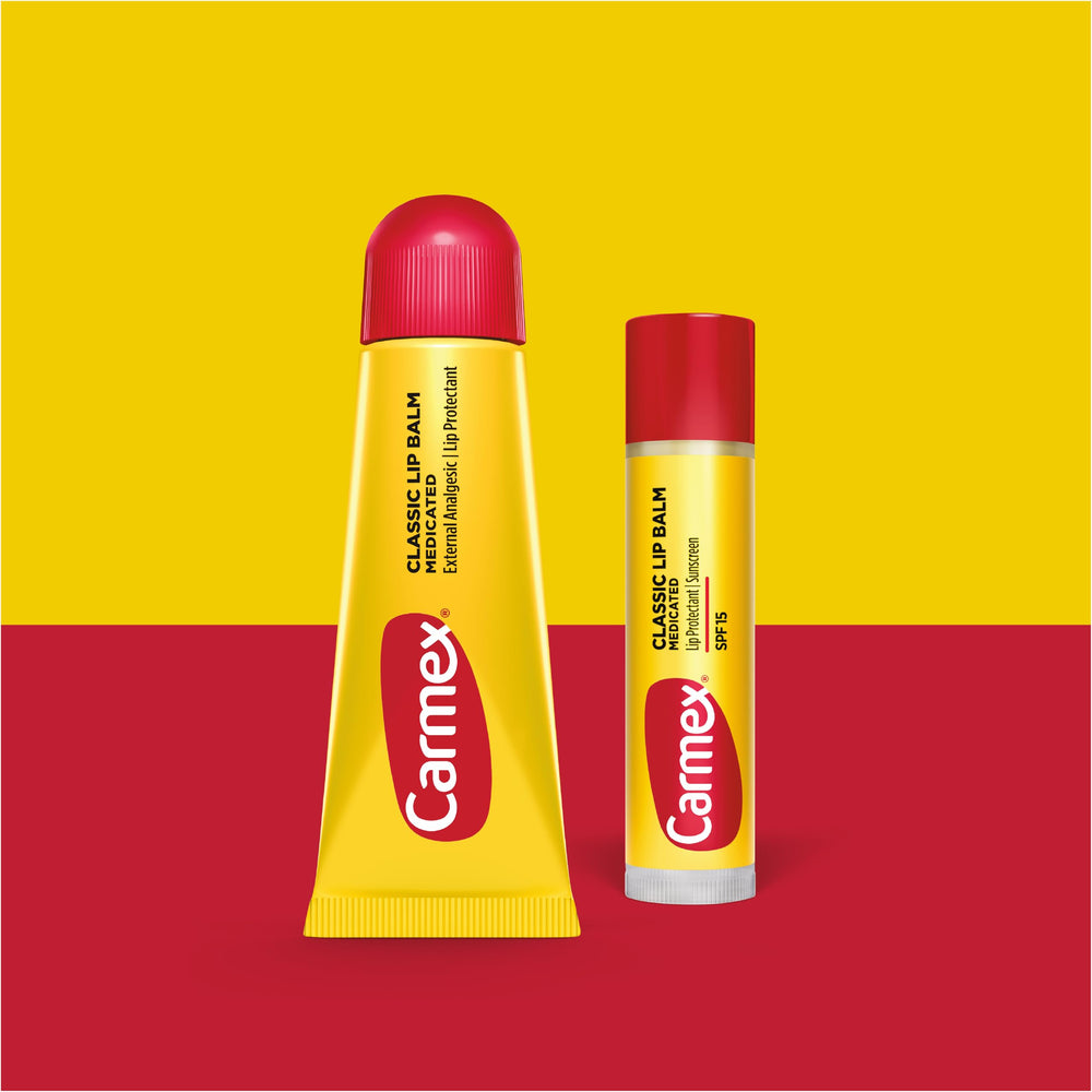 Carmex lip balm stick with sunscreen image shows SPF 15 protection outdoors.