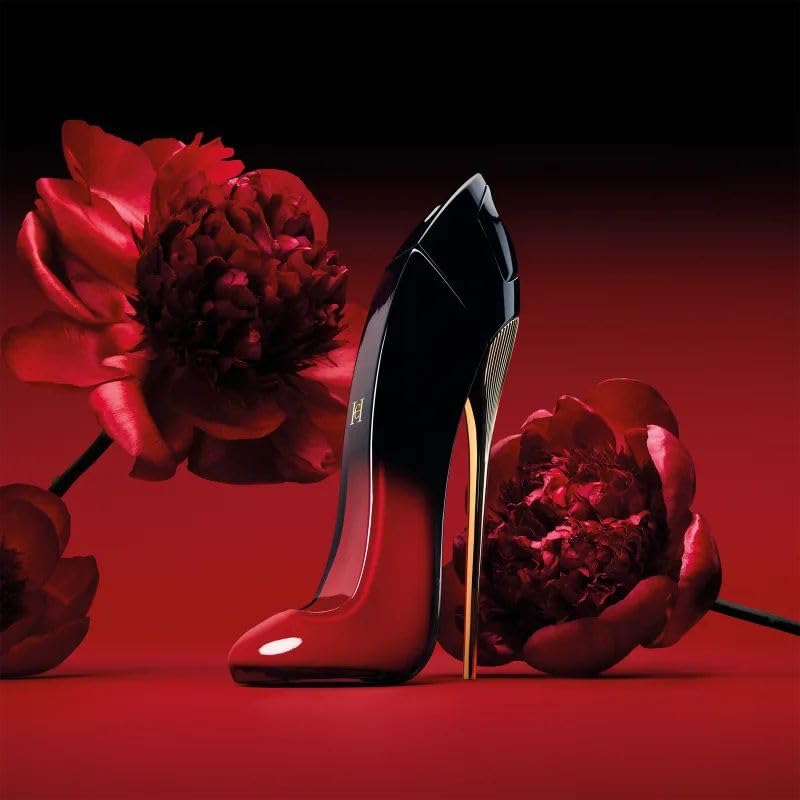 Carolina Herrera Very Good Girl Elixir on a dresser, showcasing bold evening wear.