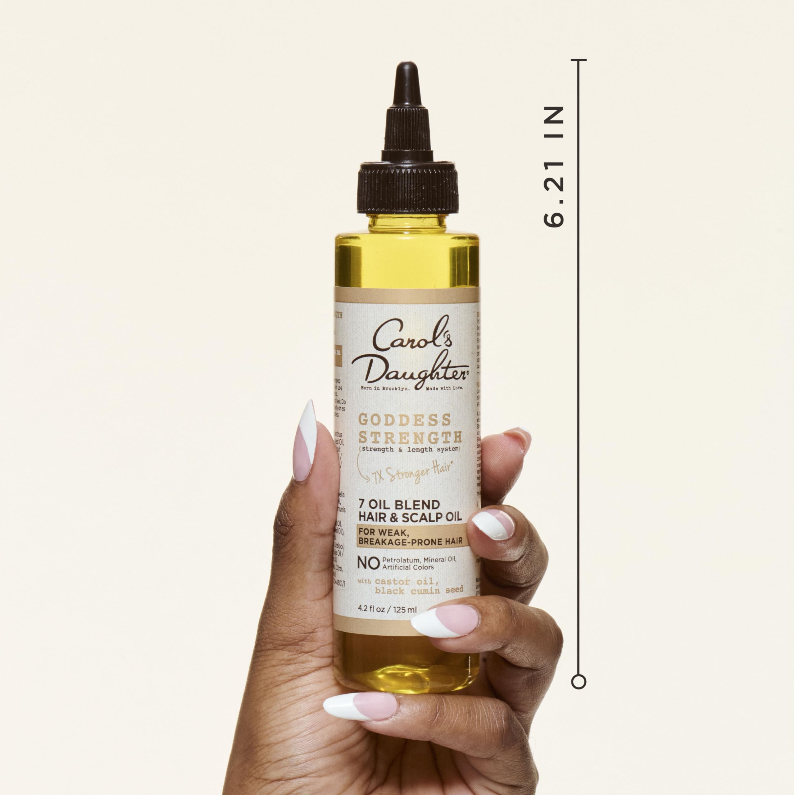 Close-up of Goddess Strength oil adds shine to curls.