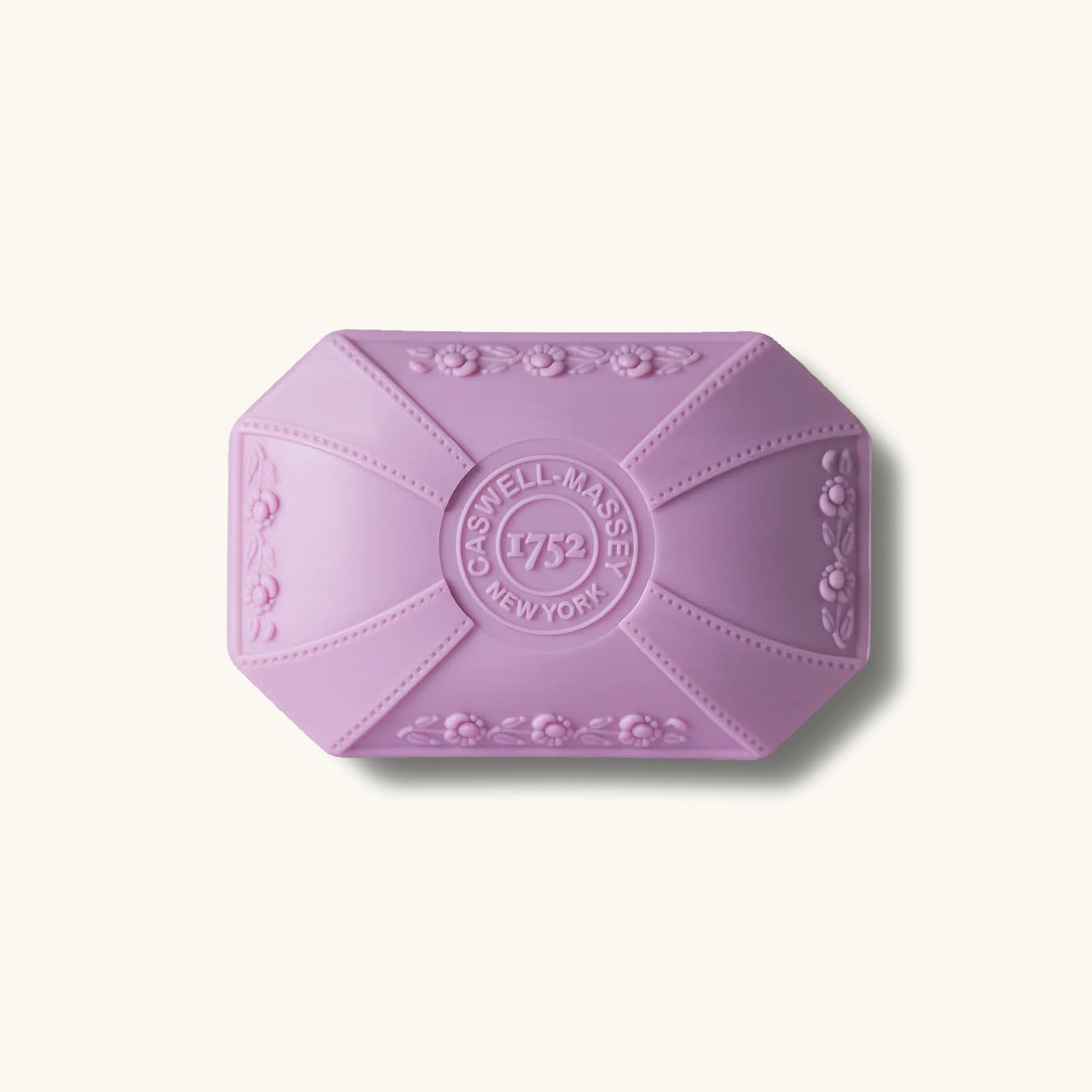 Caswell-Massey Lilac Bar Soap hands-use setup at sink shows luxury routine.