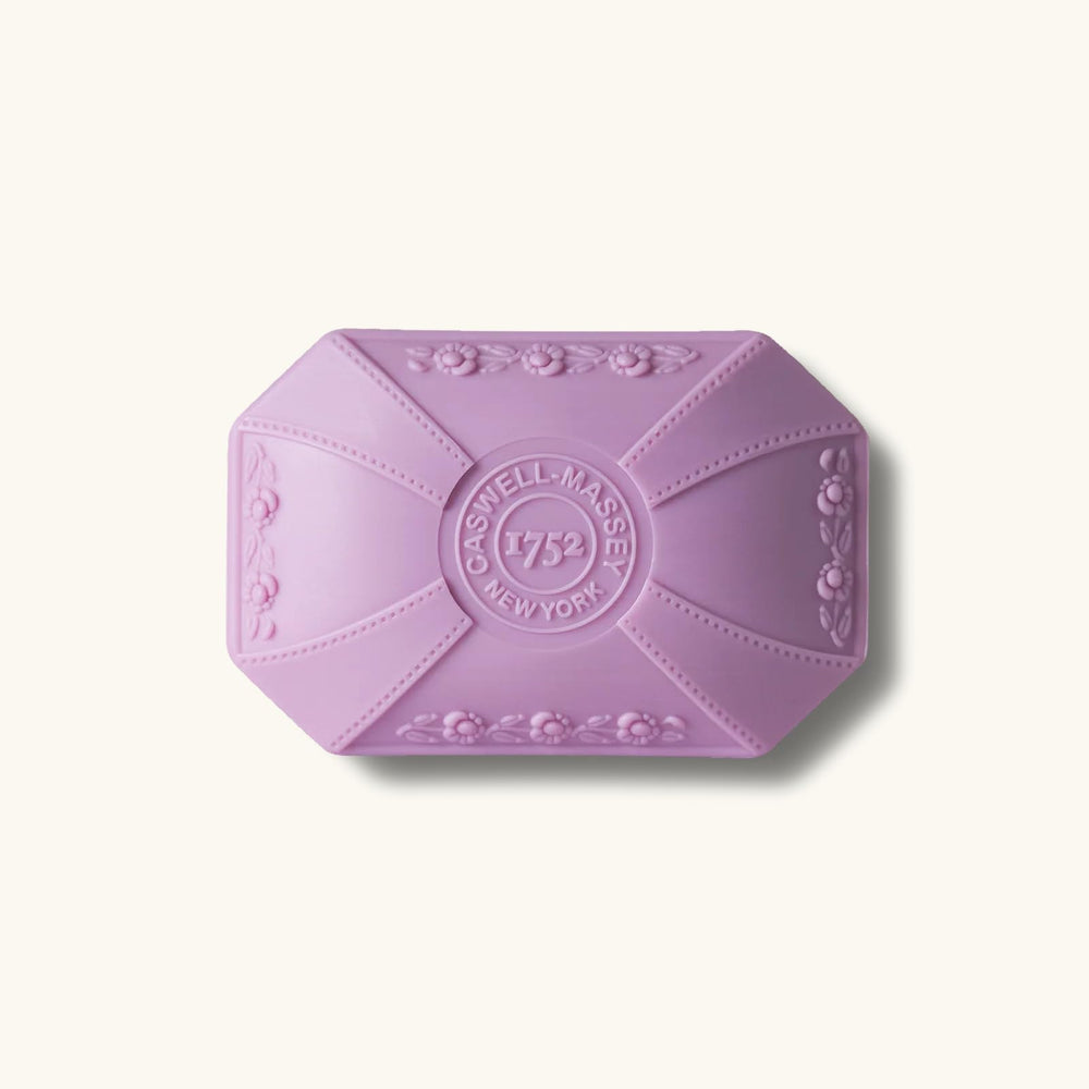 Caswell-Massey Lilac Bar Soap hands-use setup at sink shows luxury routine.
