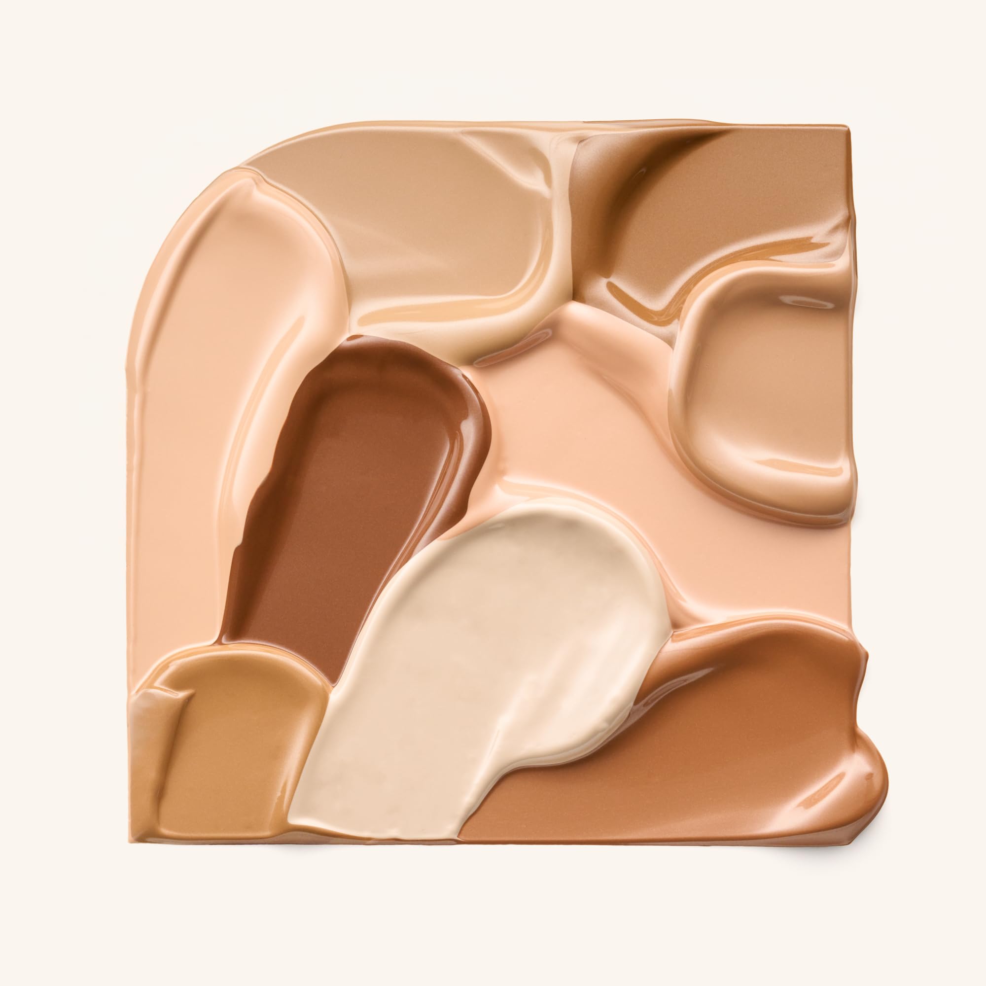Catrice Soft Glam Filter Fluid highlighter swatch with pearlescent glow.