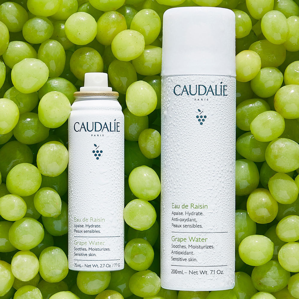 Caudalie Grape Water Mist applied to skin for hydration.