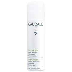 Caudalie Grape Water Mist travel-size bottle for on-the-go hydration.