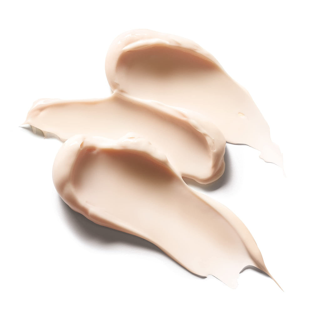 Caudalie Premier Cru application on face and neck for enhanced absorption.