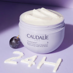 Caudalie body butter texture close-up showcases creamy consistency for a soothing massage.