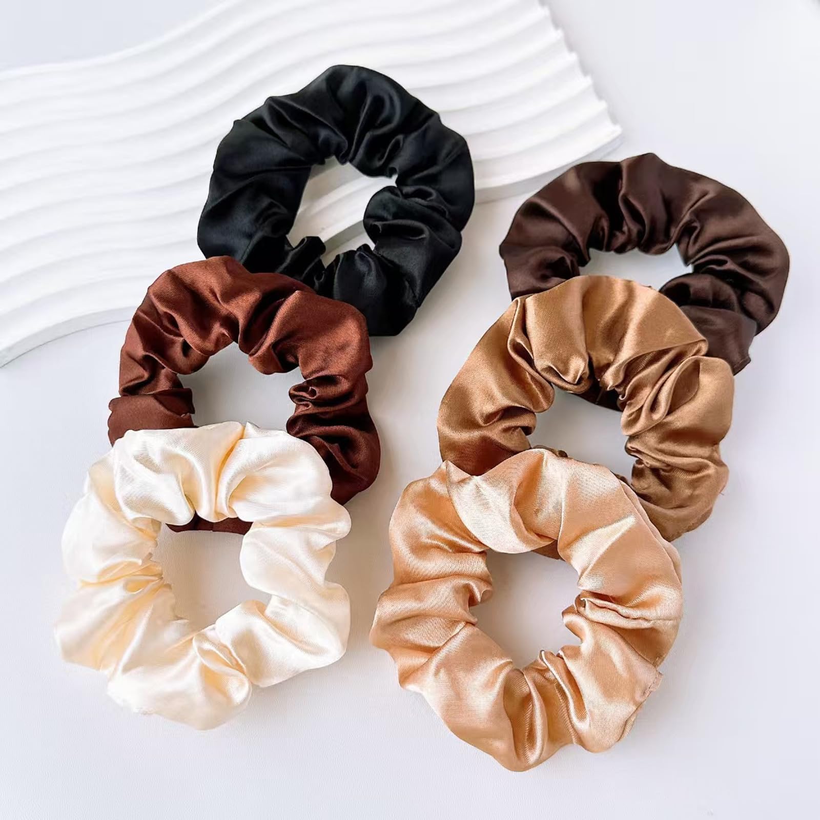 CAZYTOYZ daily-wear satin scrunchies arranged for gifting and use.