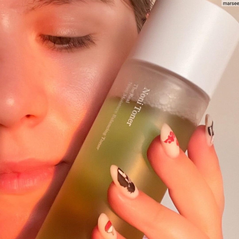 Celimax Noni Toner texture closeup shows lightweight, refreshing finish.