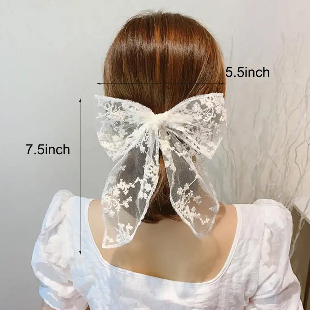 CELLIFEZY big white lace bow clip provides classic bridal flair.