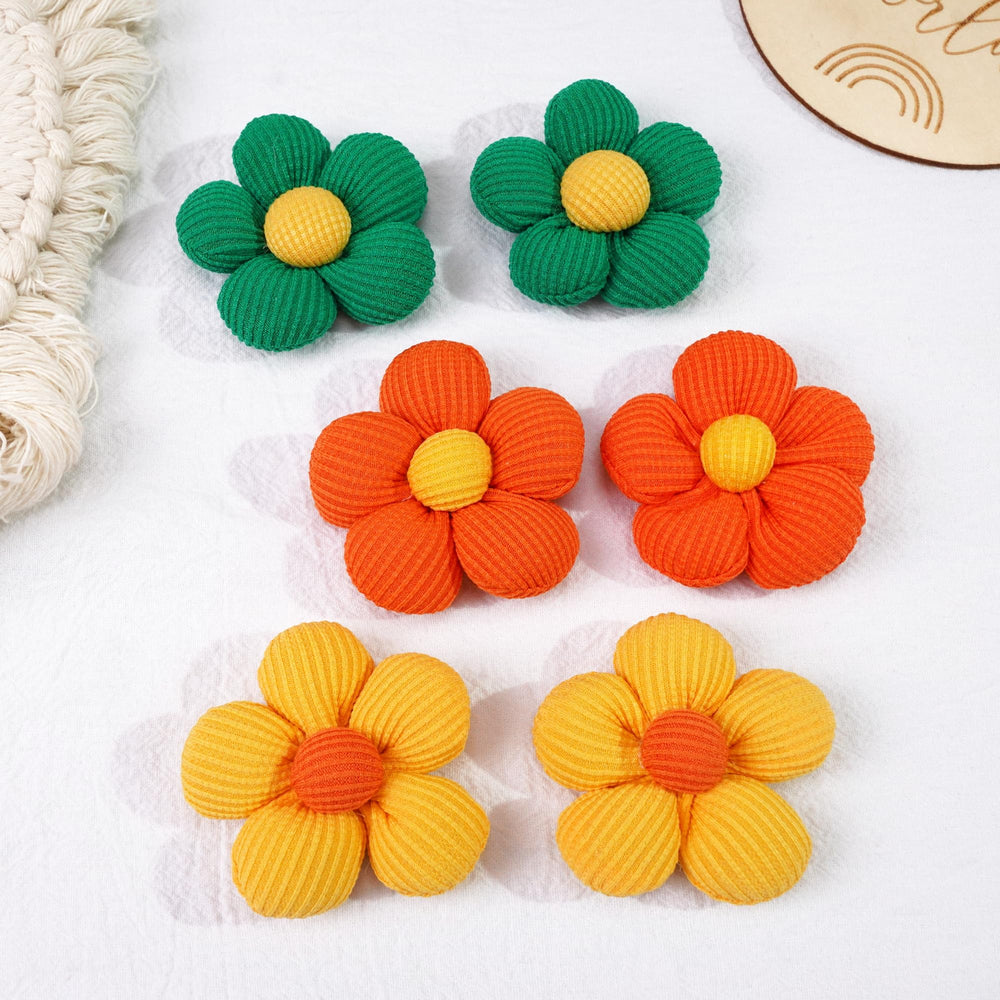 CÉLLOT flower hair tie on-model demonstrates easy ponytail styling