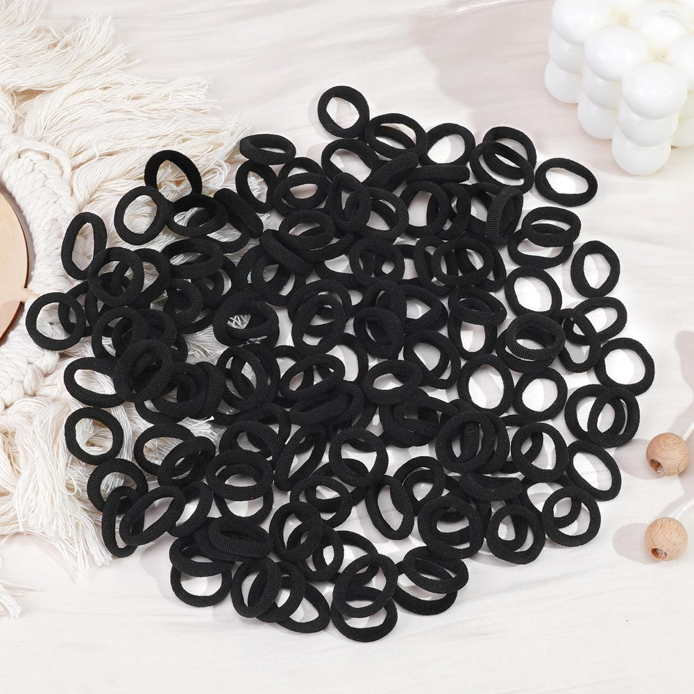 CÉLLOT toddler wearing hair ties shows secure fit during play.