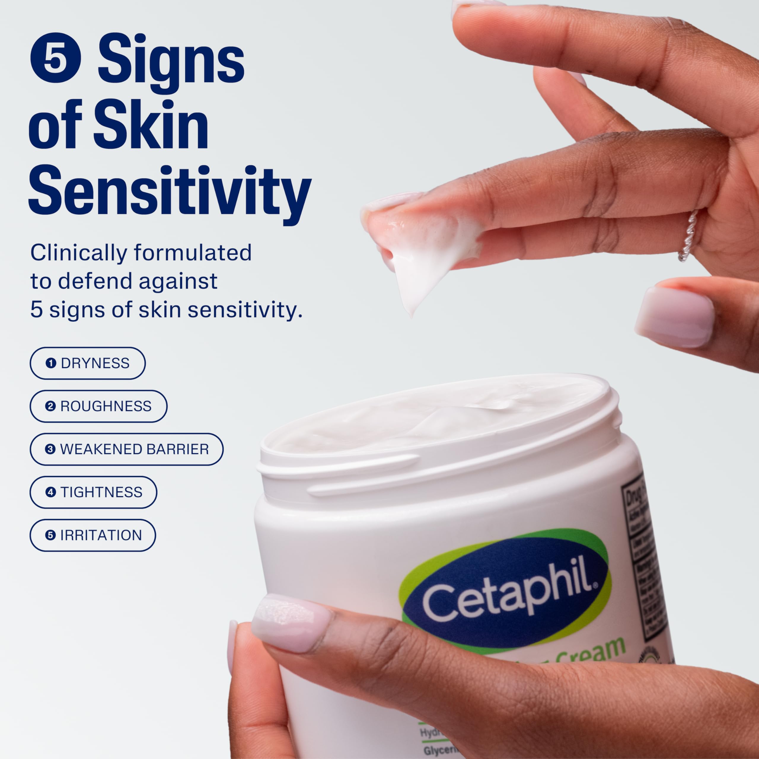 Cetaphil moisturizing cream applied to a hand for dry-skin relief.