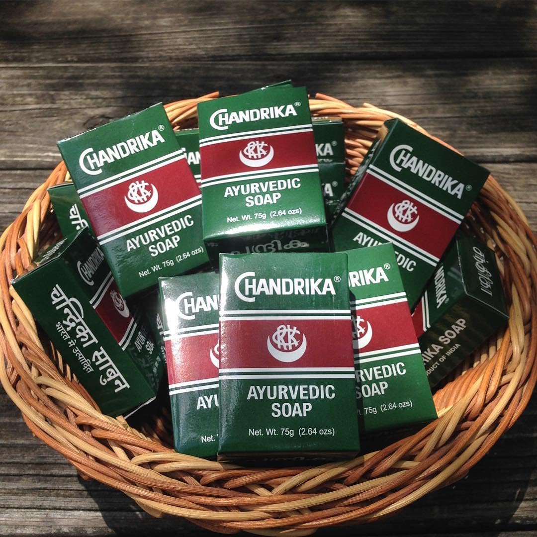 Chandrika soap lather closeup showing creamy foam and gentle cleansing.