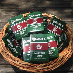Chandrika soap lather closeup showing creamy foam and gentle cleansing.