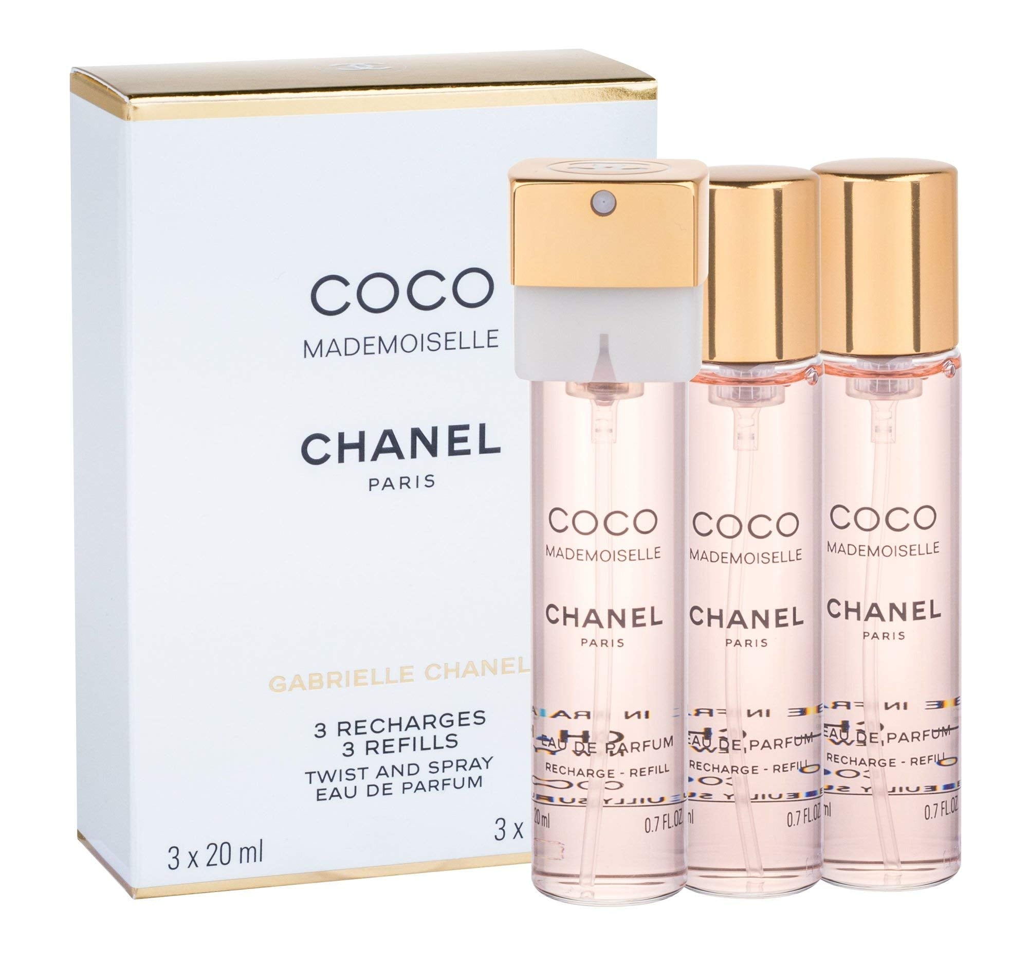 Chanel Coco Mademoiselle Twist & Spray refill bottle in use for fresh scent refresh.