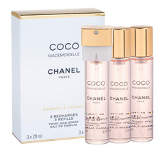 Chanel Coco Mademoiselle Twist & Spray refill bottle in use for fresh scent refresh.