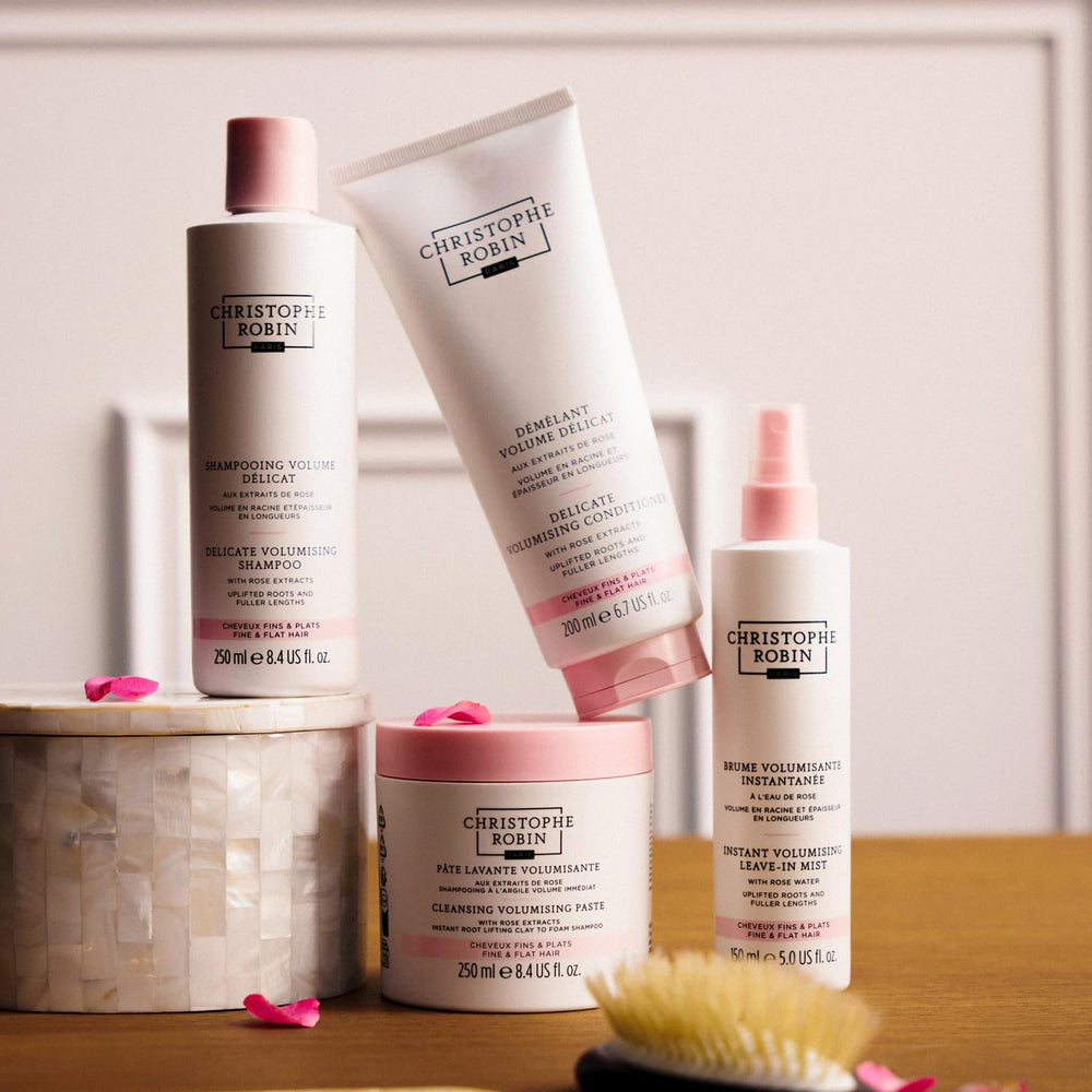 Christophe Robin Delicate Volumizing Conditioner application on hair suggests added volume and hydration
