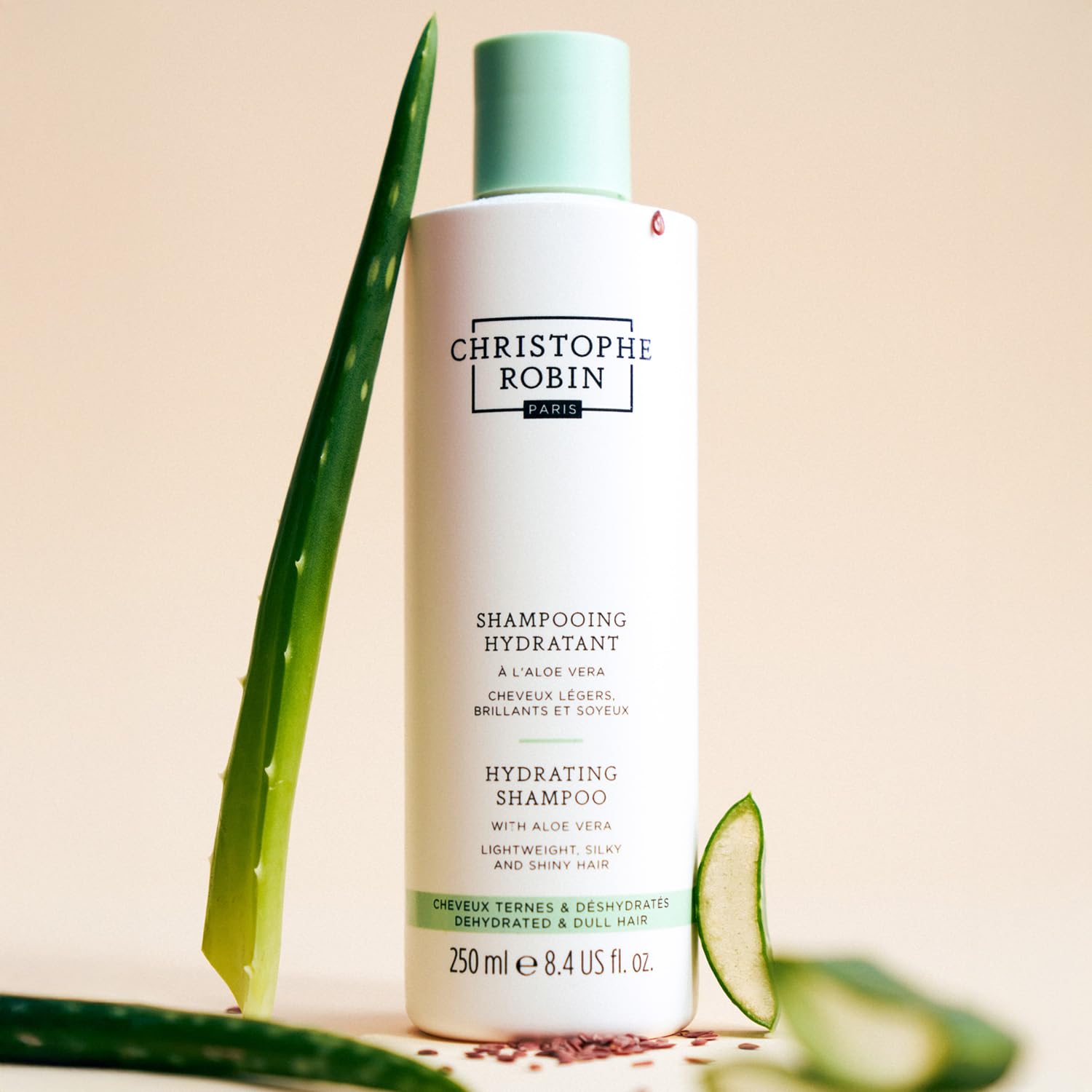 Christophe Robin Hydrating Shampoo aloe vera gel closeup emphasizes soothing hydration from plants.