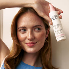 Christophe Robin volumising mist application shows rose-water lift for lengths.