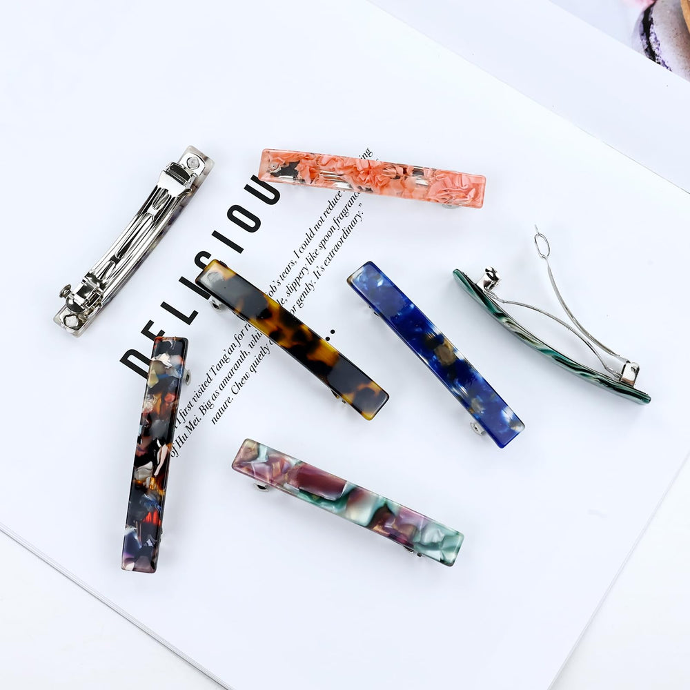 Cinaci glossy black barrette clip highlights durable spring for long-lasting use.