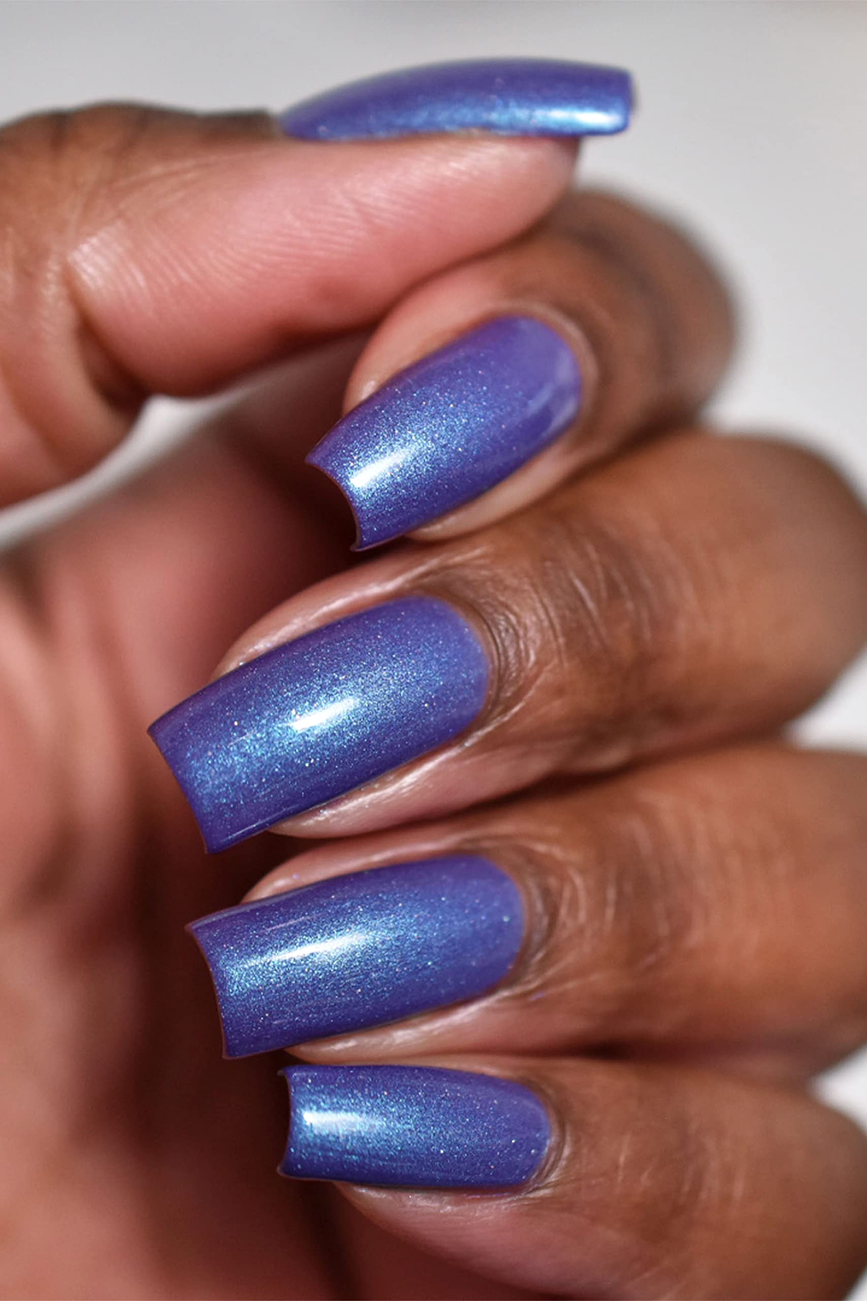 Cirque Colors Luna warm-turquoise state reveals vibrant color under warm ambient light.
