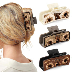 Ciyvolyeen Highland cattle hair clip close-up showing sturdy leather grip for secure styling.