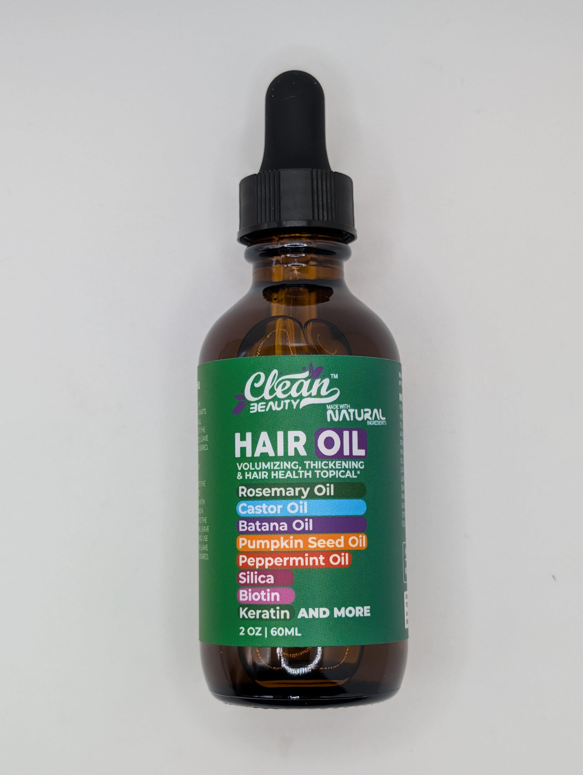 Clean Beauty Keratin Oil application shows smoothing, frizz control potential.