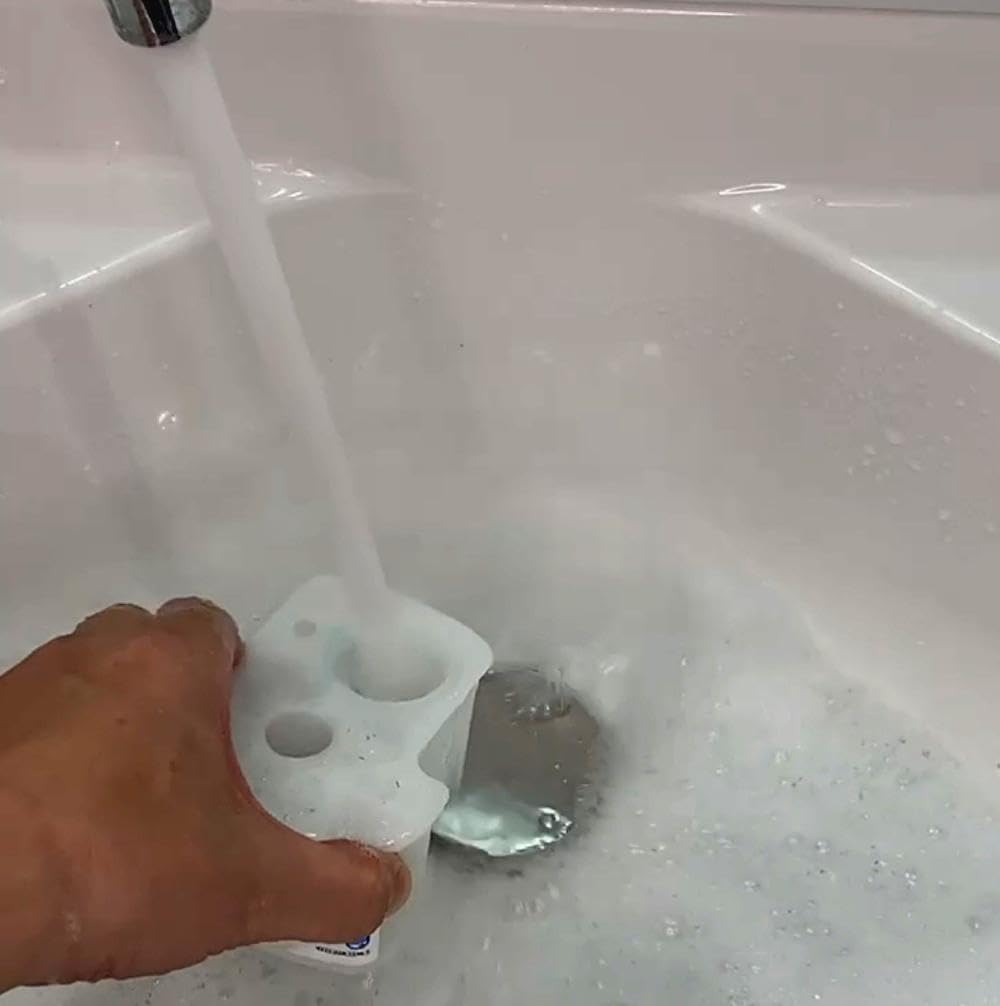 Cleanu shake-and-fill moment illustrates simple at-home maintenance workflow.