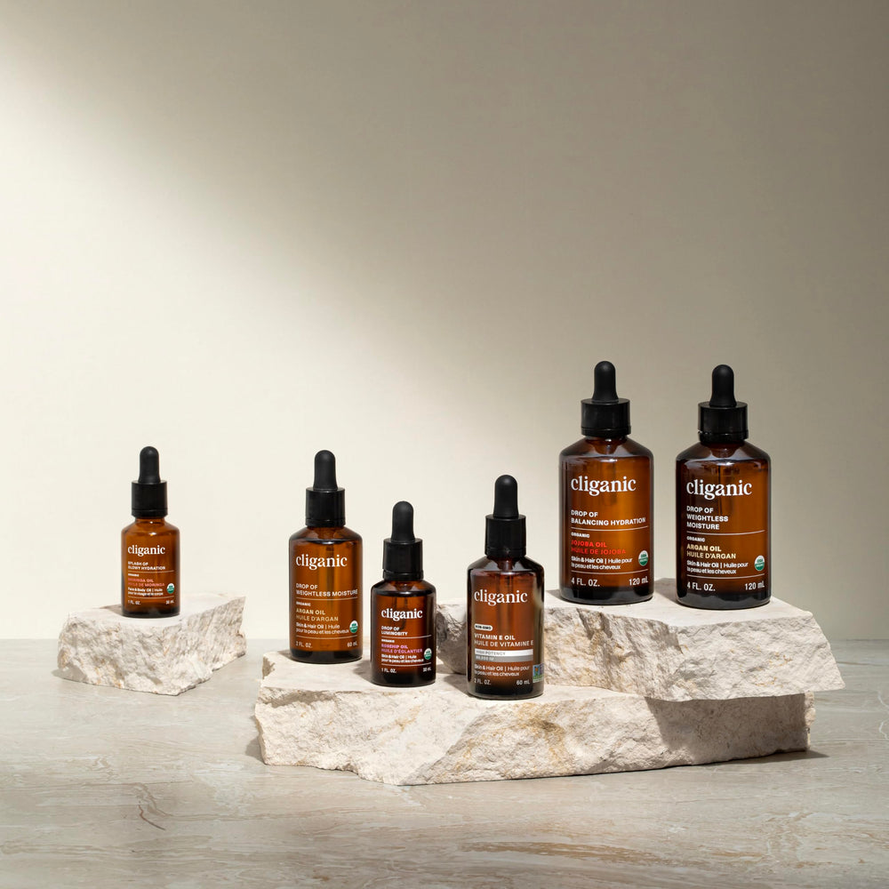 Hands applying Cliganic Baobab Oil for a lightweight, hydrating skincare routine.