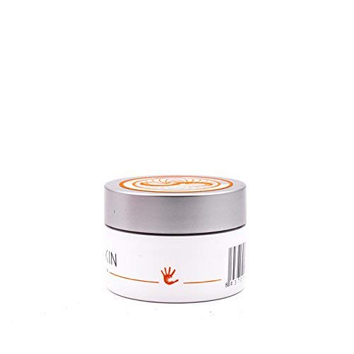 Climbskin hand cream on chalk-dusted hands during training for grip-ready moisture.