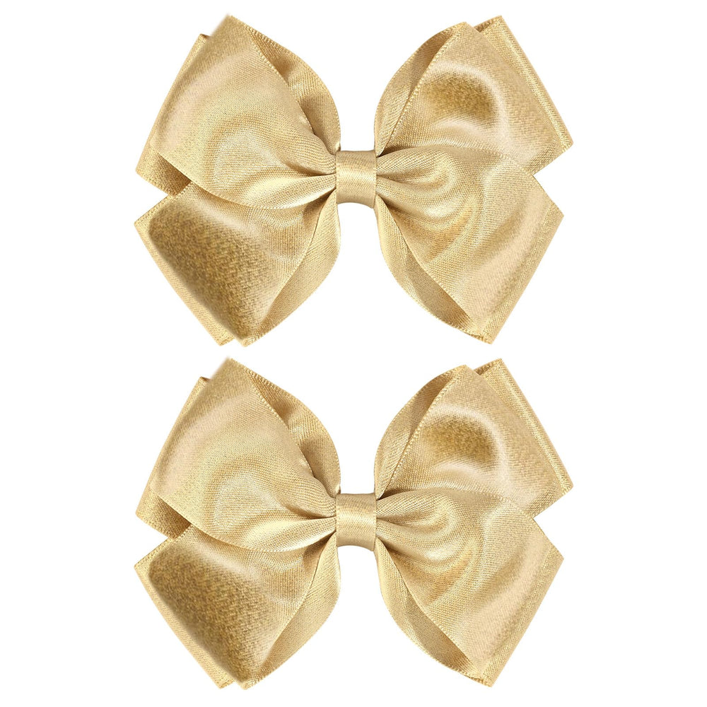 CN gold glitter hair bow clip closeup with shimmering satin finish for party-ready sparkle