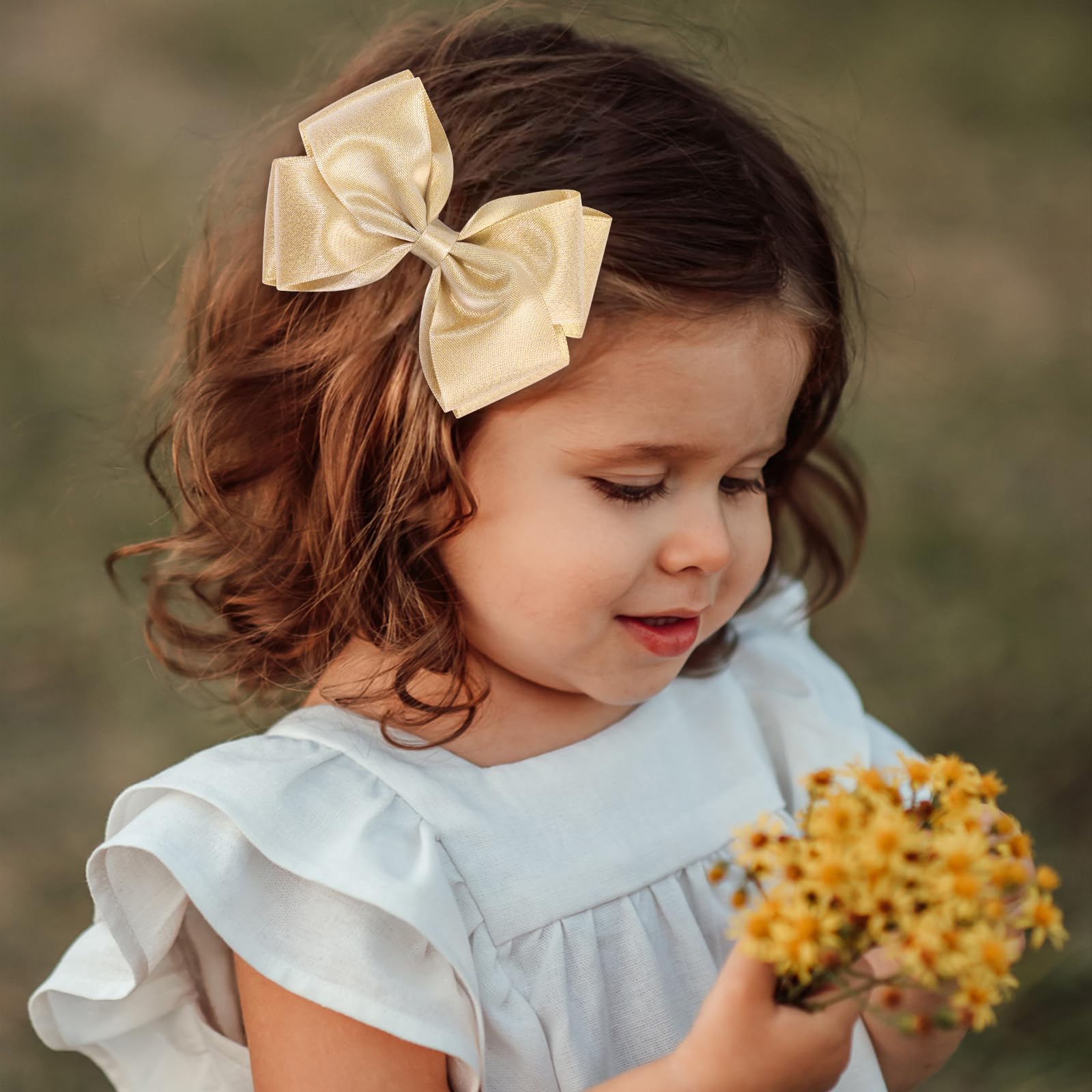 CN gold glitter hair bow clip reflects sunlight with eye-catching sparkle