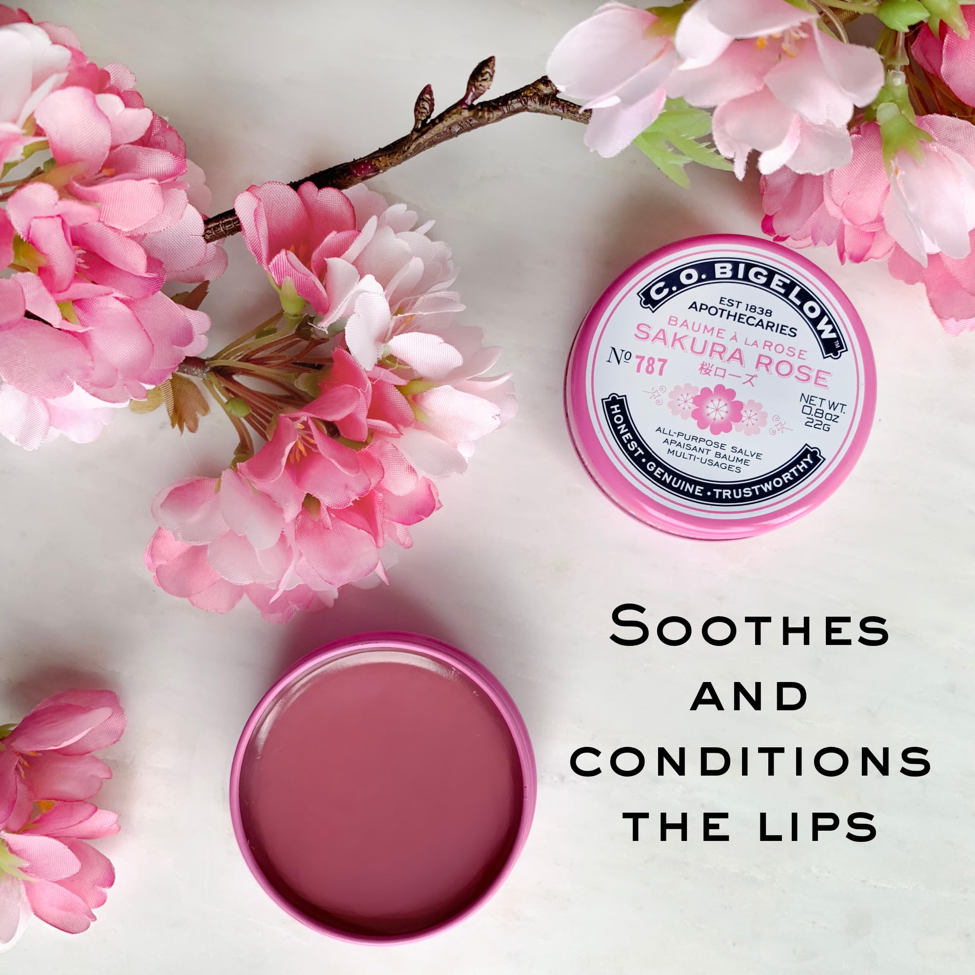 C.O. Bigelow Sakura Rose Salve tin on a desk for quick hydration during work.