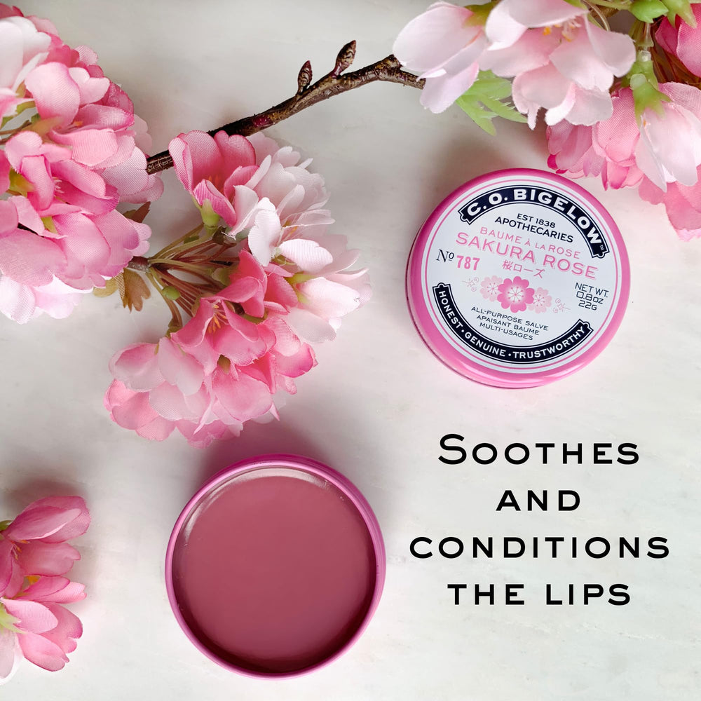 C.O. Bigelow Sakura Rose Salve tin on a desk for quick hydration during work.