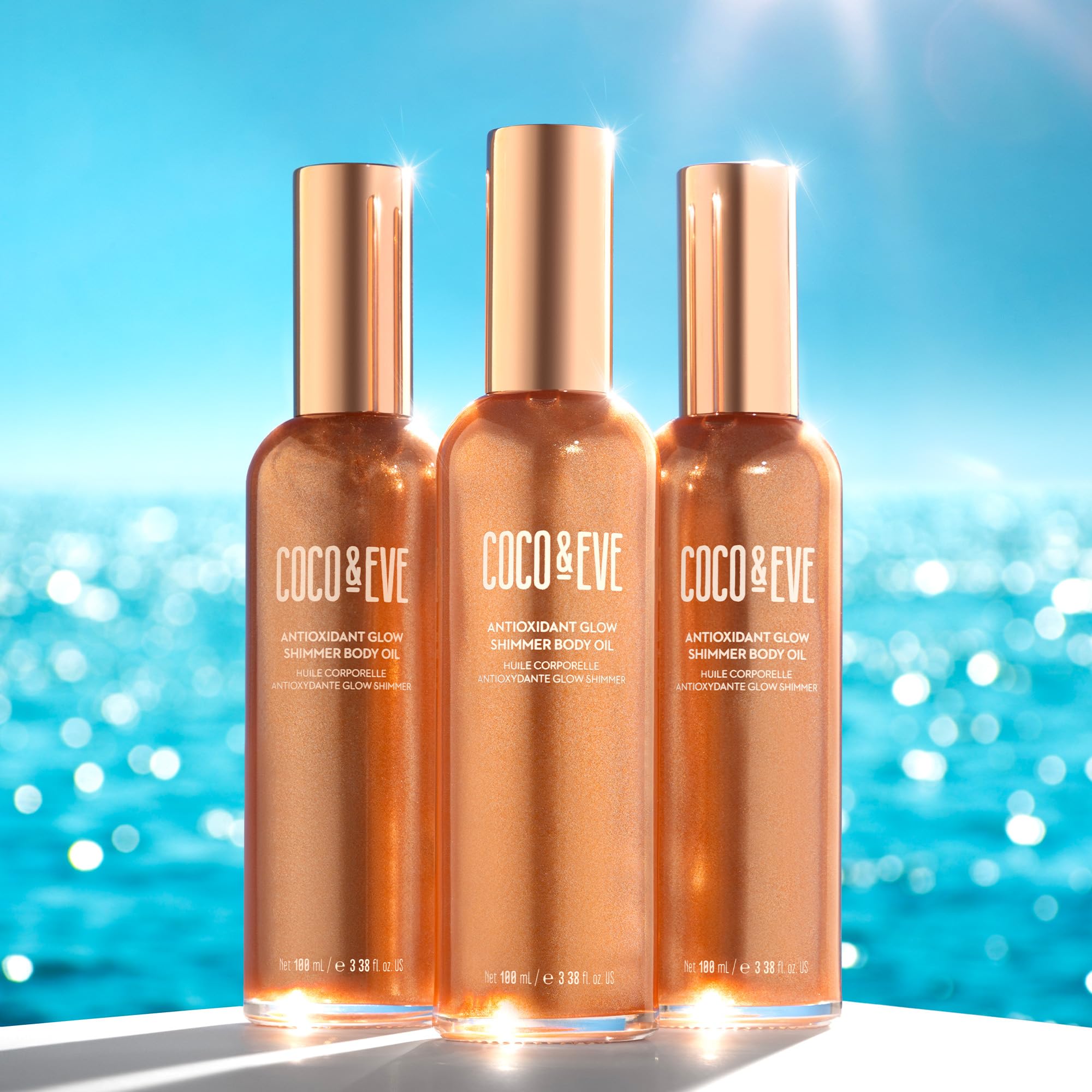 Coco & Eve Antioxidant Glow Shimmer On-Skin Glow highlights bronzy-gold radiance for day or night.