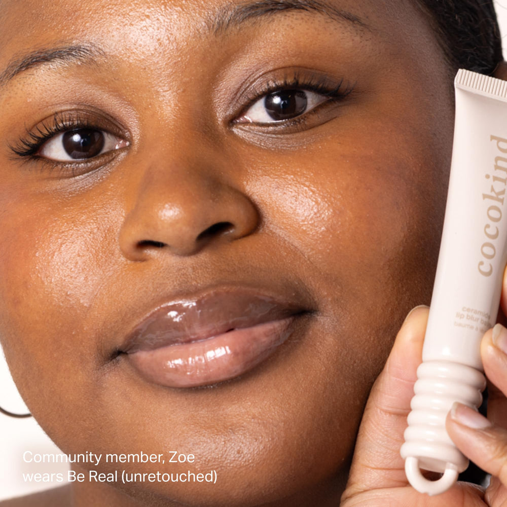 Cocokind Ceramide Lip Blur Balm Be Real on lips implies long-wear hydration.