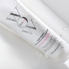 COLOR WOW Color Security Conditioner dispensing action highlights easy, even application