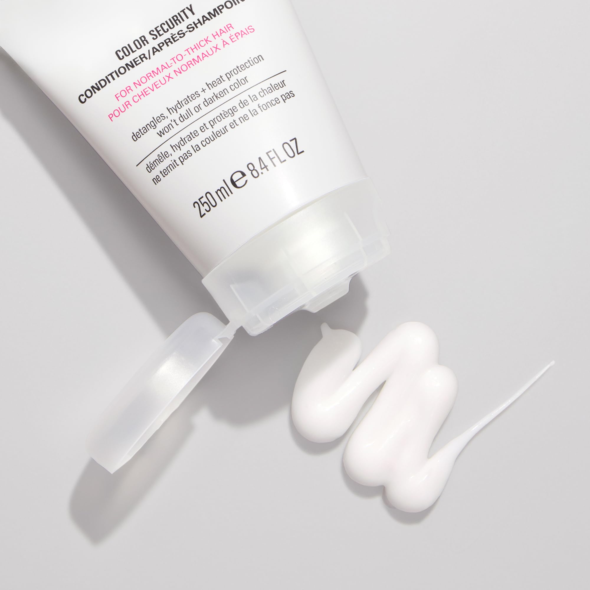 COLOR WOW Color Security Conditioner on shiny hair strands suggests gloss and manageability